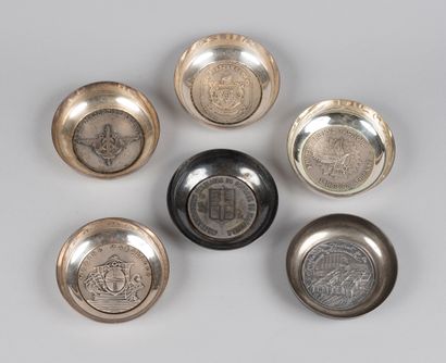 Set of cups centered with commemorative silver...