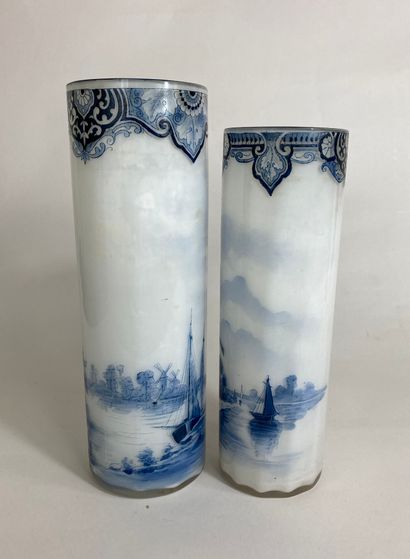 null Two white opaline glass vases with painted decoration of a Dutch river landscape....