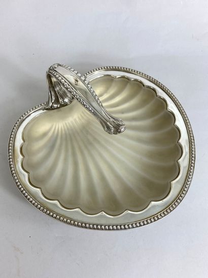 null Silver-plated metal bowl in the shape of a scallop shell surrounded by a row...