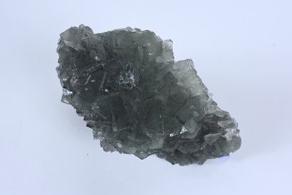 null Large block of bottle green fluorite with small transparent calcite crystals...