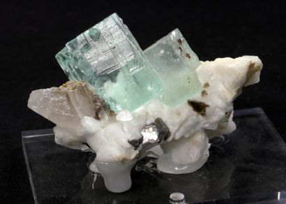 null Aquamarine on feldspar from Shigar, Pakistan. 
Two crystals of 2,5cm corroded...