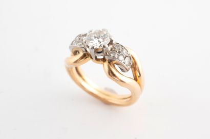 null 18k yellow gold and platinum ring set with a 0.85ct diamond in a diamond-paved...