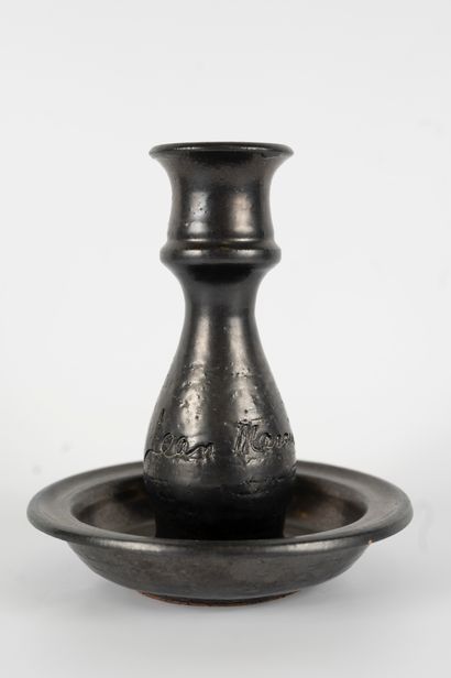 null Jean MARAIS (1913-1990)
Black glazed ceramic candlestick. 
Signed on the body.
Height:...