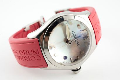 null CORUM
BUBBLE" model
Steel watch. Round case, mother-of-pearl dial with Arabic...