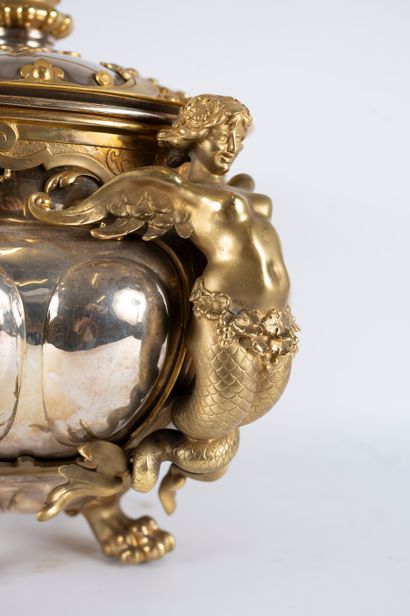 null Large covered cup in silver-plated metal and gilt bronze. The gadrooned body...