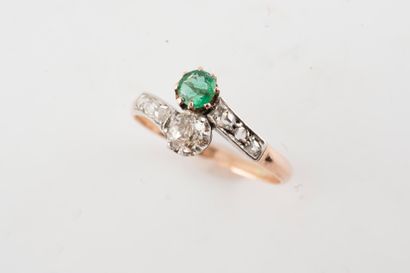 null 18k yellow gold and platinum ring set with an old-cut diamond and a round emerald....