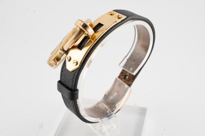 null HERMES Paris
Model "KELLY
Ladies' wristwatch, black leather strap, gold dial,...
