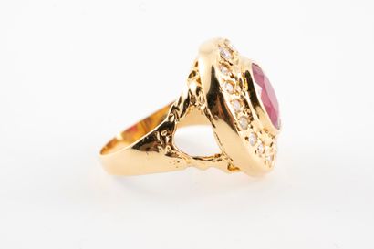 null 18k yellow gold ring centered on an oval ruby weighing approx. 4cts in a setting...