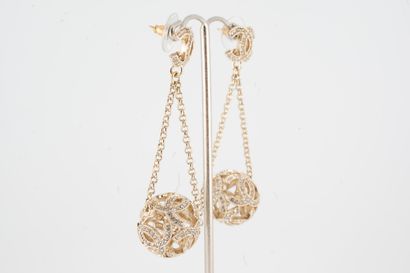 null CHANEl, Circa 2016
Pair of gilded metal earrings featuring an openwork sphere...