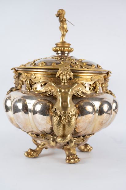 null Large covered cup in silver-plated metal and gilt bronze. The gadrooned body...