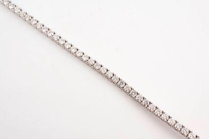 null 18k white gold diamond rivière bracelet set with 58 brilliant-cut diamonds weighing...