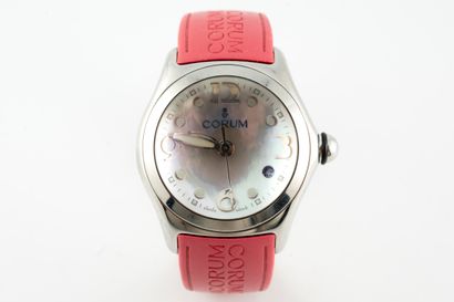 null CORUM
BUBBLE" model
Steel watch. Round case, mother-of-pearl dial with Arabic...
