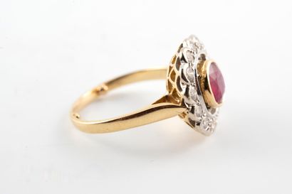 null Flower ring in 18k yellow gold set with a round ruby surrounded by brilliant-cut...