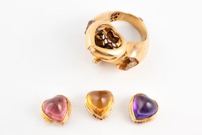 null 18k yellow gold heart ring topped with an interchangeable heart-cut cabochon...