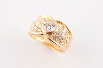 null 18k yellow gold ring centered with a brilliant-cut diamond weighing approx....
