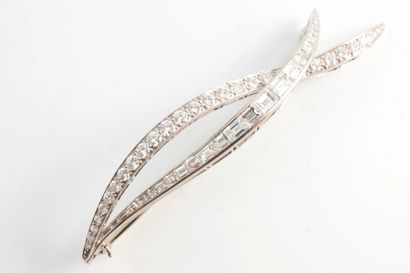 null Platinum brooch formed by two moving lines of diamonds set with emerald-cut...