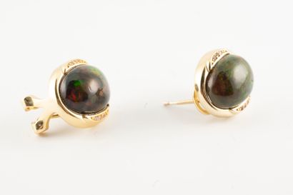 null Pair of vermeil ear studs set with cabochon black opals accented with fine lines...