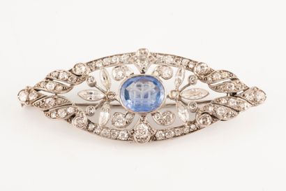 null White gold and platinum navette brooch centered on a sapphire intaglio of approx....