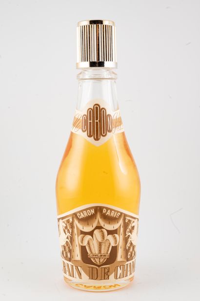 null CARON « Royal Bain de Champagne »
Flacon en verre figurant une bouteille de...