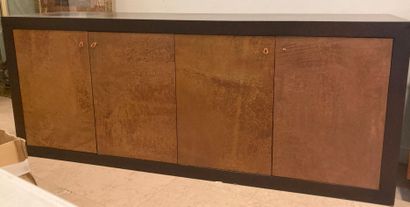 null Exotic wood sideboard. Opens to four leather-covered doors. 
Modern work in...