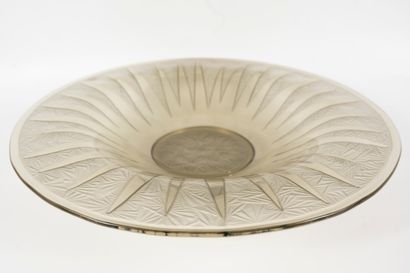 null Large flat bowl in pressed-molded smoked glass with radiating decoration. 
French...