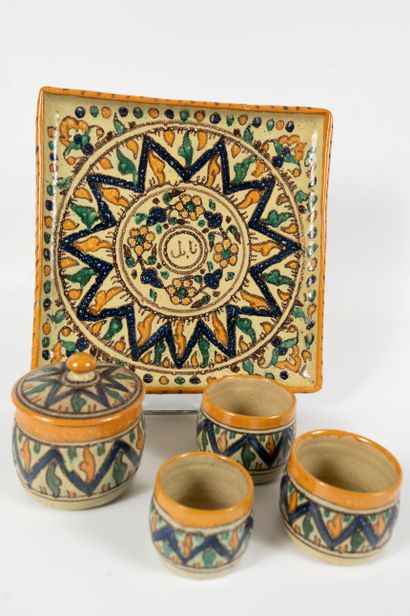 null NABEUL polychrome ceramic service including a tray, a sugar bowl and three cups.
The...