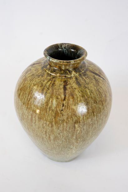 null Green enameled earthenware vase with narrow neck.
Stamped under the base
Height:...