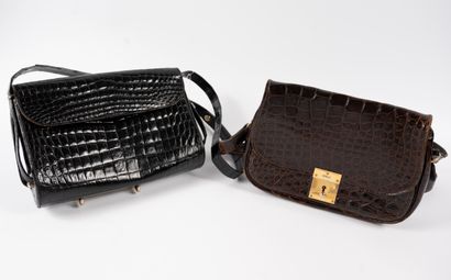 null Set of two brown and black leather shoulder bags.
(as is)
