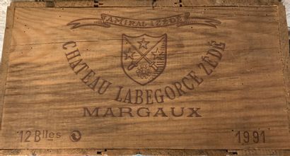 null A case of twelve bottles of Margaux wine, La Begorce Zédé, 1991.
(Unopened wooden...