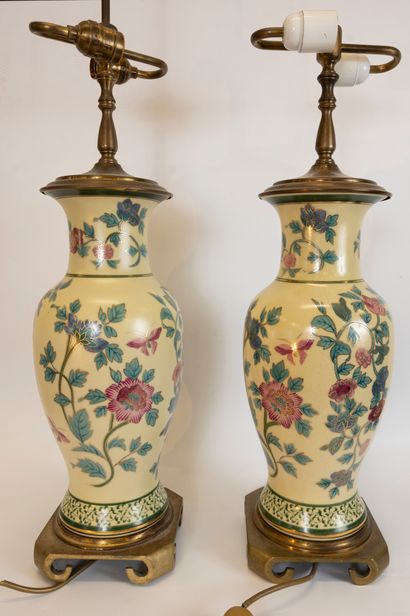 null Pair of porcelain lamp bases decorated with flowers, foliage and polychrome...