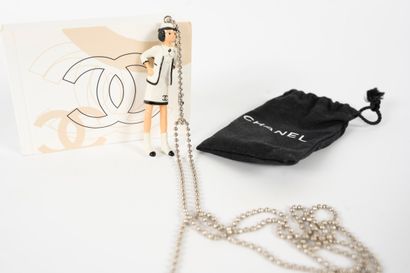 null COCO CHANEL 
A keychain in its pouch with its flipbook. 
Height: 8cm
