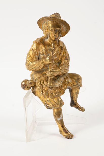 null Gilt bronze clock representing a seated flute player.
19th century
Height: approx....