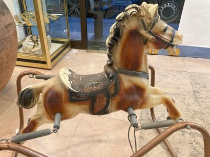 null Antique rocking horse on springs.
Painted plastic and metal structure.
