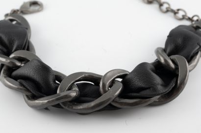 null CHANEL, Circa 2020
Blackened metal bracelet with gourmette links trimmed with...