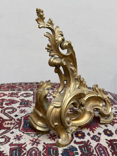 null Mantel elements including a pair of ormolu andirons with rocaille motif, and...