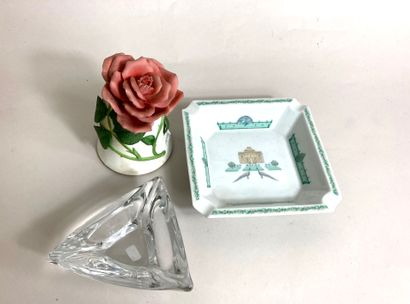 null Lot including: 
- DAUM. Triangular crystal ashtray. Signed. Width: 10cm. 
-...