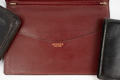 null HERMES lot:
- Black leather billfold/purse,
- 2 notebook envelopes, one burgundy,...