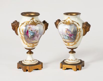 null Pair of PARIS porcelain vases with polychrome decor of gallant scenes in landscapes...