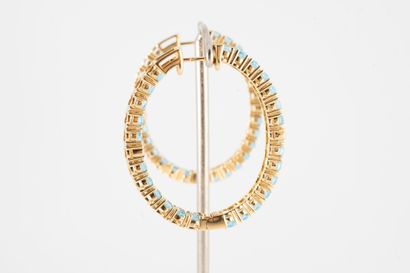 null Pair of 18k yellow gold hoop earrings entirely set with oval topazes and adorned...