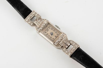 null Ladies' watch in platinum. Rectangular case paved with diamonds, watch and bracelet...