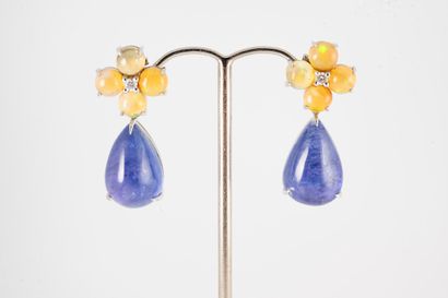 null A pair of 18k white gold earrings with a flower motif formed of four opal cabochons...