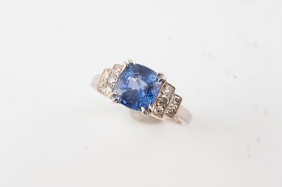 null 18K white gold ring set with a 2.42cts unheated cushion sapphire flanked by...