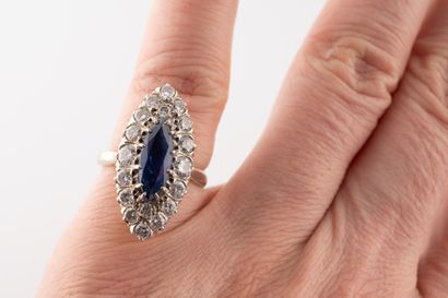 null 18k white gold marquise ring set with a marquise-cut sapphire approx. 2cts surrounded...