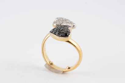 null Toi Moi ring in 18k yellow gold, formed by two hearts paved with white and black...
