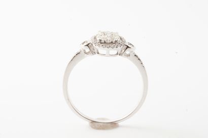 null Ring in 18k white gold, the finely openwork oval-shaped bezel entirely paved...