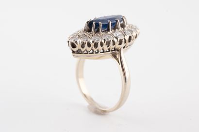 null 18k white gold marquise ring set with a marquise-cut sapphire approx. 2cts surrounded...