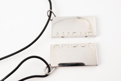 null HERMES, Paris
Two pendants to share, forming the word "AMOUR" in palladium-plated...