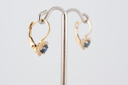 null Pair of 18k yellow gold sapphire heart sleeper earrings set in diamonds. 
Gross...