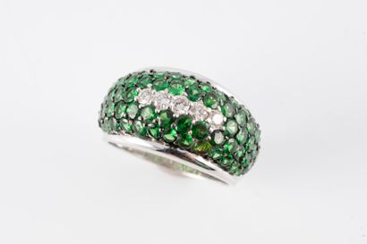 null Dome ring in 18k white gold, the dome entirely paved with tsavorites and centered...