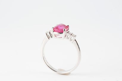 null 18k white gold ring surmounted by a natural oval Pinkish Red ruby weighing 2.17cts...